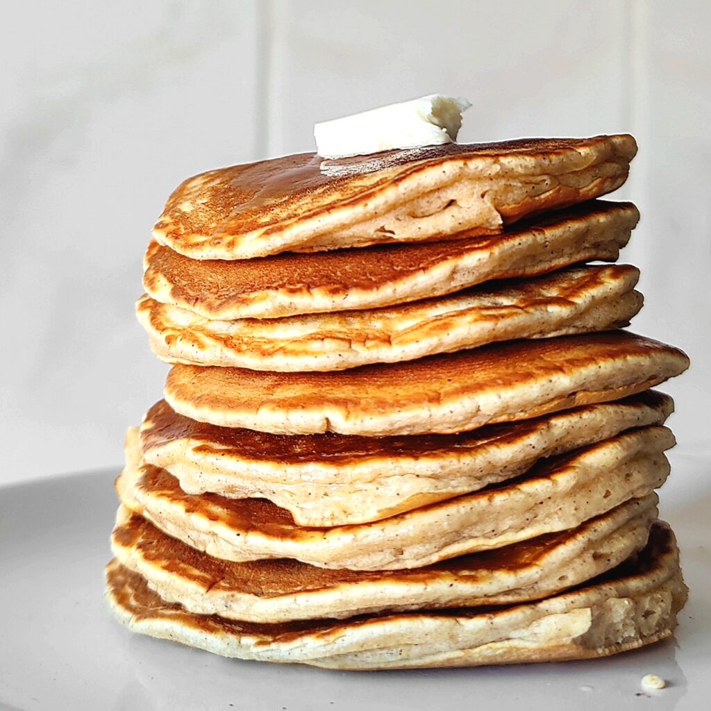 stack of pancakes with butter on top